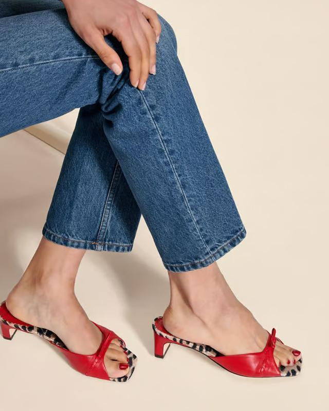 Mescini - Red peep toe block heel mules worn with cropped denim, standing view, US sizes