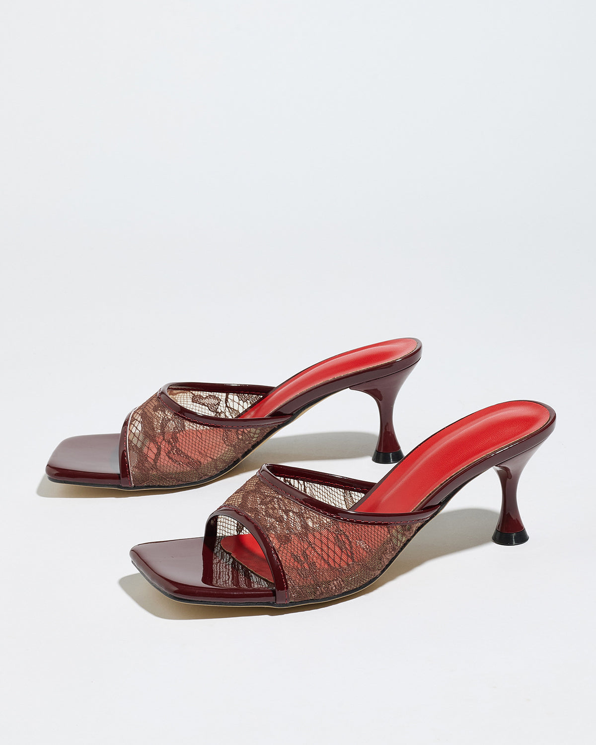 Mescini burgundy lace mesh square toe mule heels, pair angled on a pale backdrop, US women's sizes