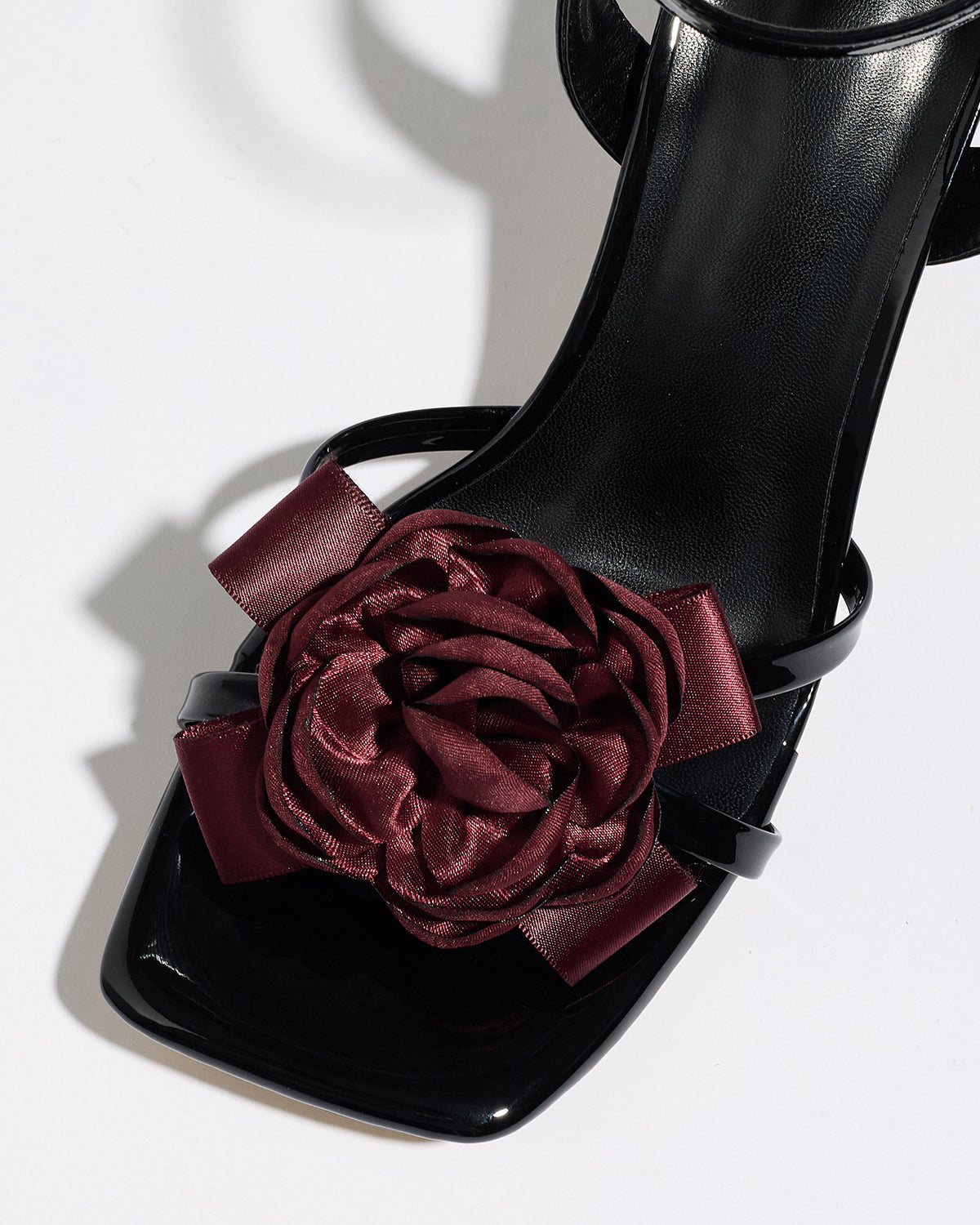 Mescini black rosette square toe strappy sandals, close up of the burgundy flower, US women's sizes