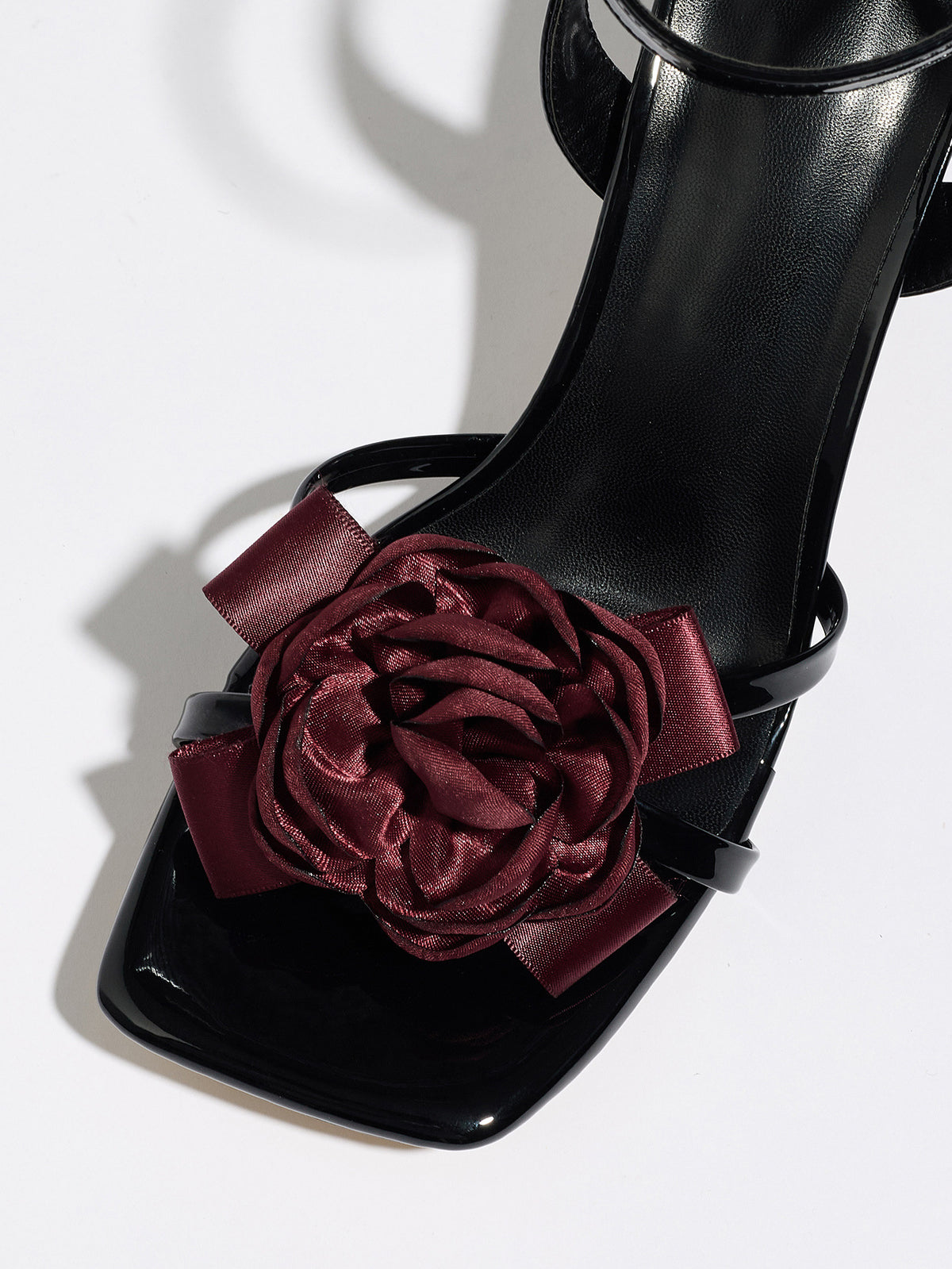 Mescini black rosette square toe strappy sandals, close up of the burgundy flower, US women's sizes