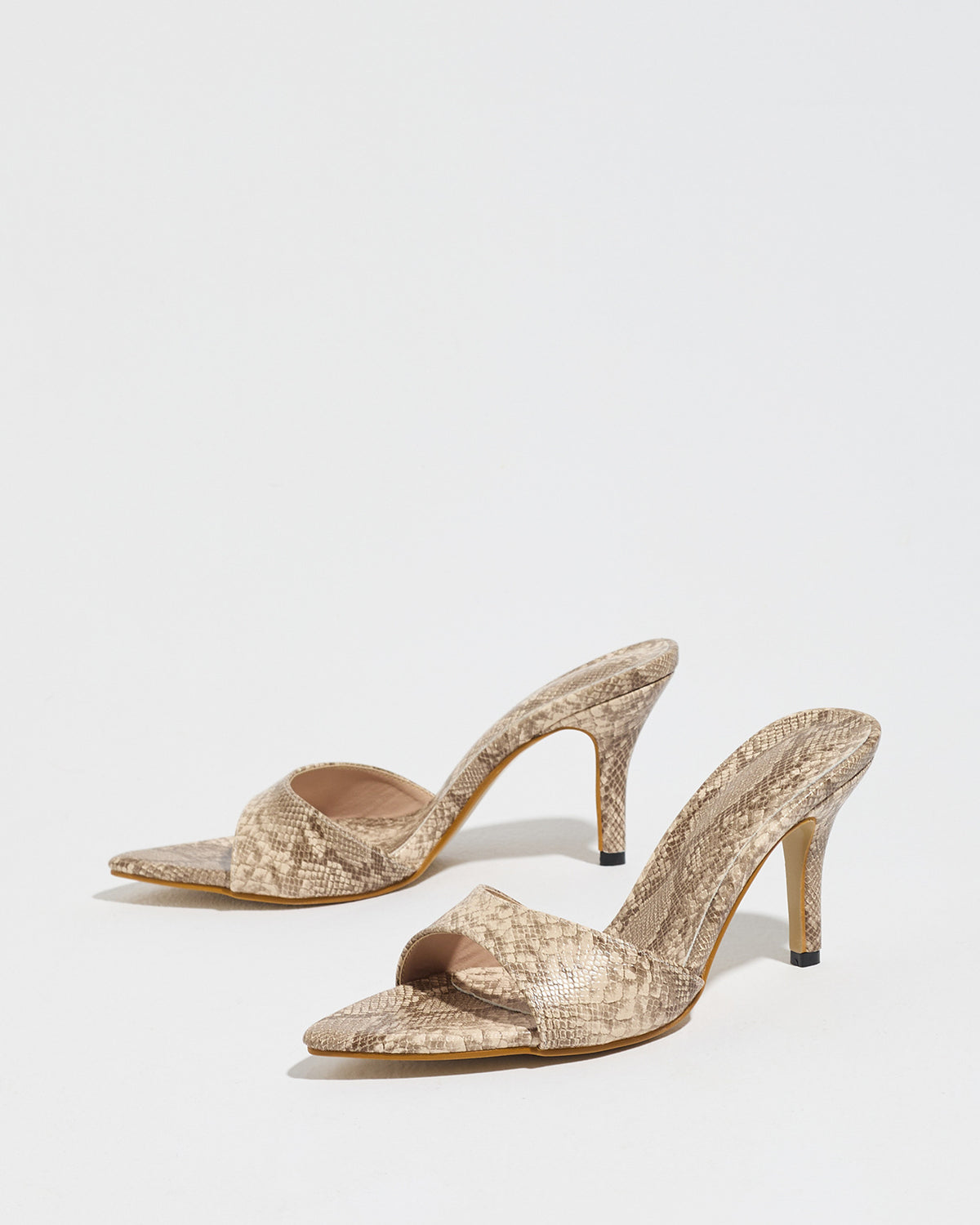 Mescini apricot snake print pointed toe mule heels, low angle view of both shoes, US women's sizes