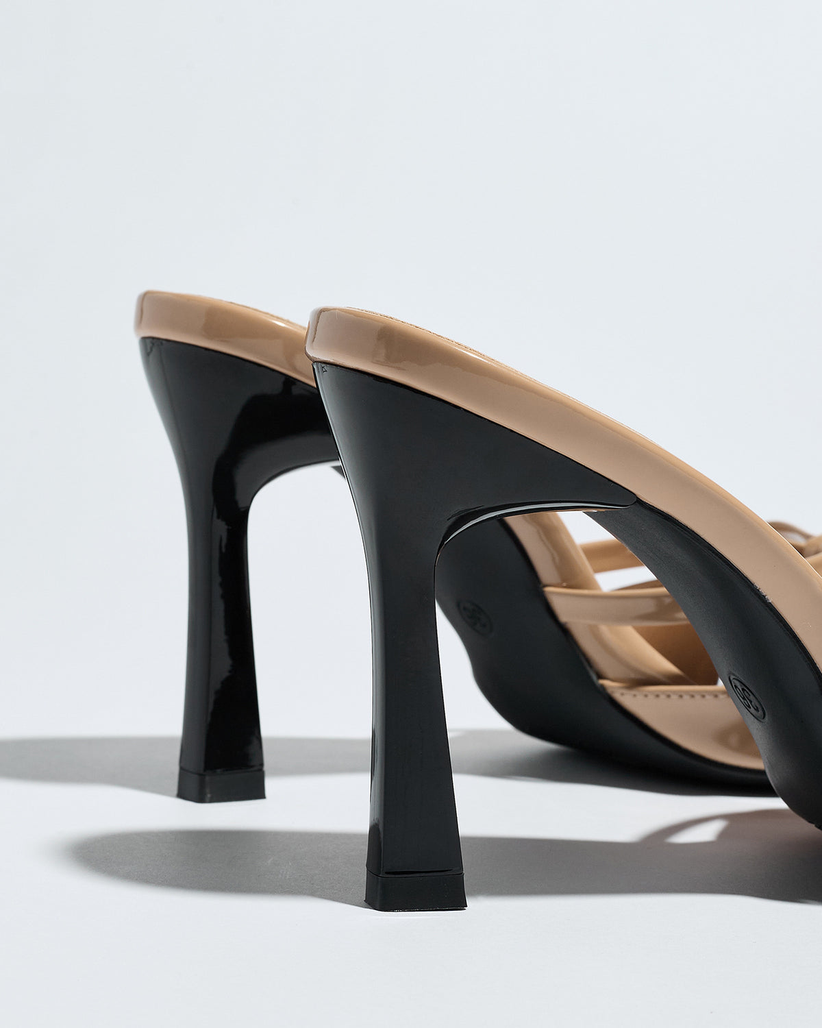 Mescini apricot bow pointed toe stiletto mules, close crop of the heel shape, US women's sizes