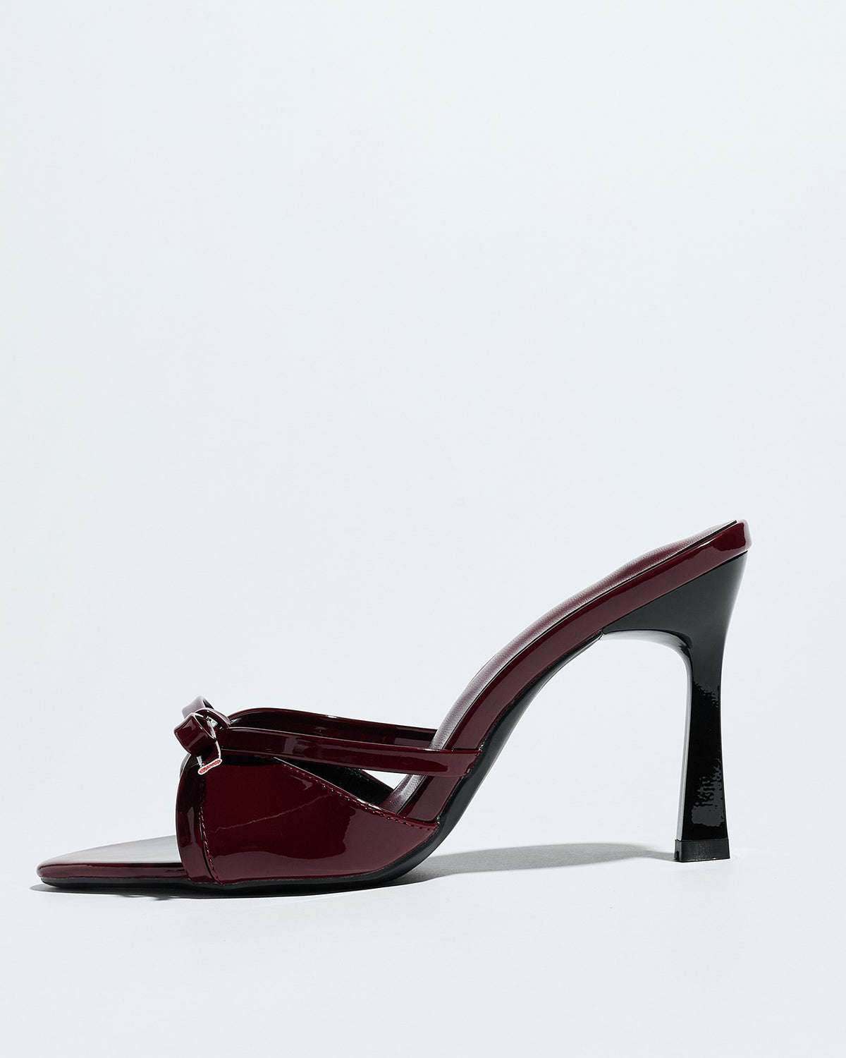 Mescini burgundy bow pointed toe stiletto mules, single shoe in full side view, US women's sizes