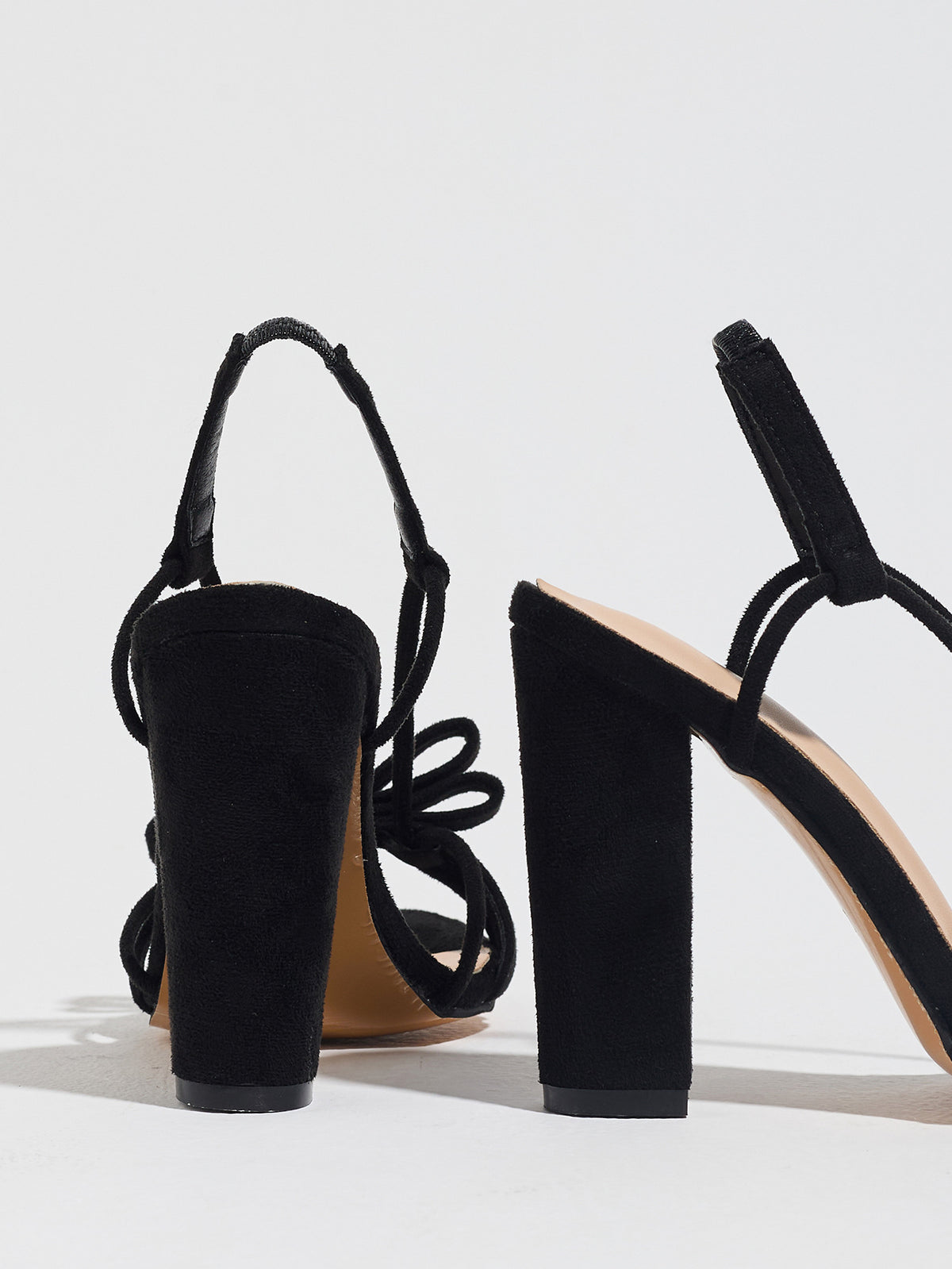 Mescini black knotted bow strappy block heel sandals, seen from behind at an angle, US women's sizes