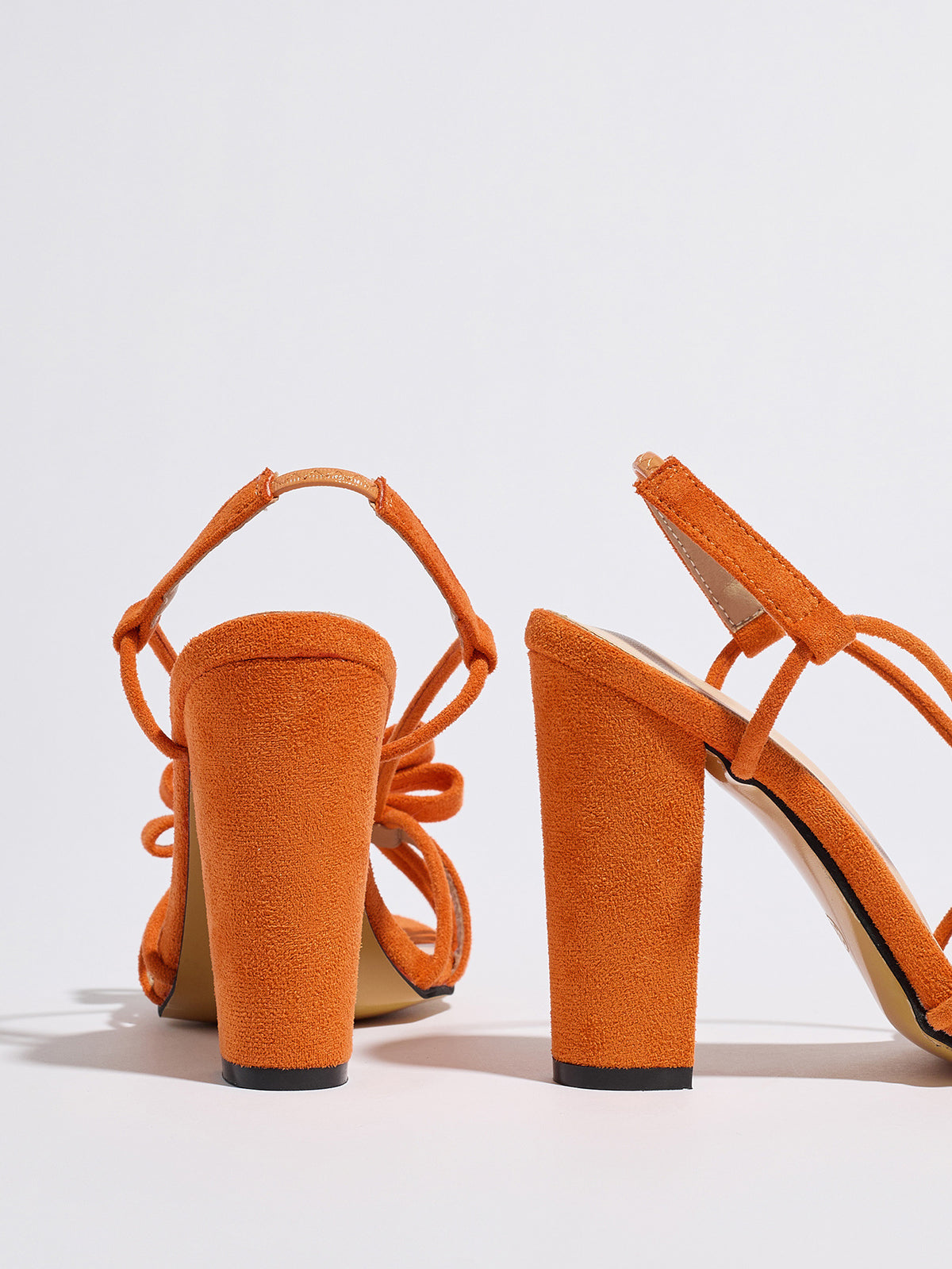 Mescini orange knotted bow strappy block heel sandals, seen from behind at an angle, US women's sizes