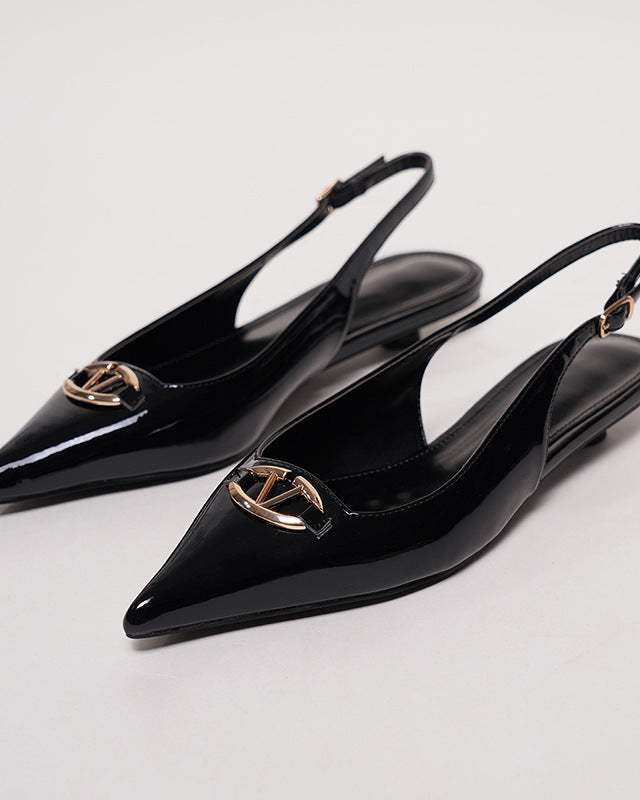 Mescini black pointed toe buckle slingback flats, pair on a white surface seen from behind, US women's sizes