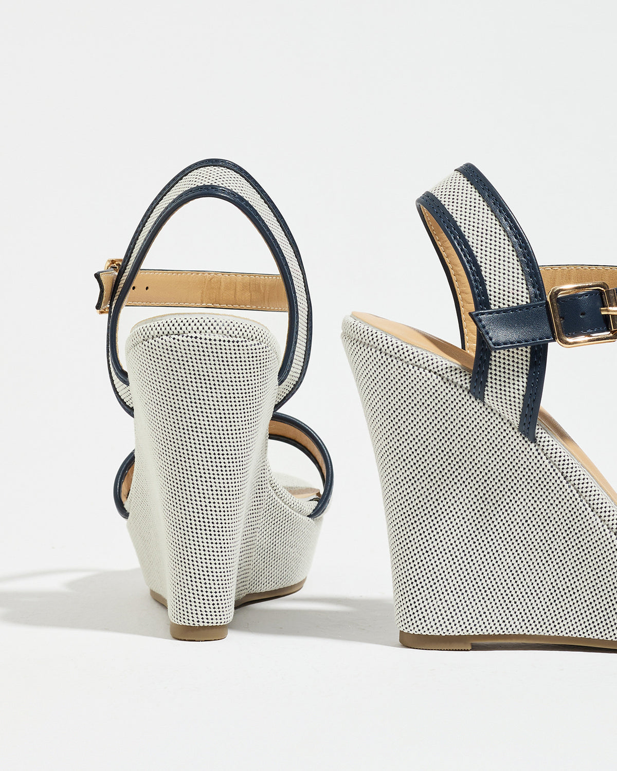 Mescini navy blue canvas platform wedge sandals, seen from behind at an angle, US women's sizes