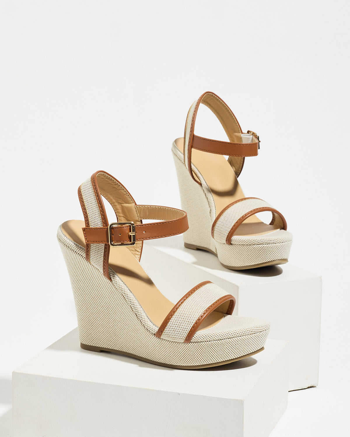 Mescini brown canvas platform wedge sandals, one shoe posed on a white riser, US women's sizes