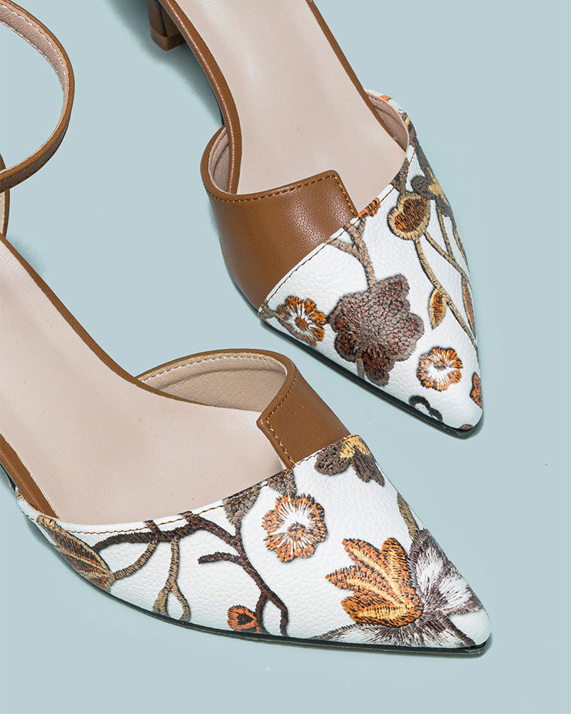 Mescini brown embroidered floral ankle strap pumps, close crop of the needlework, US women's sizes