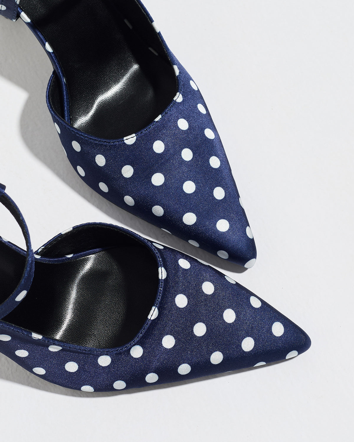Mescini navy polka dot slingback heels, close view of the two pointed toes, US women's sizes