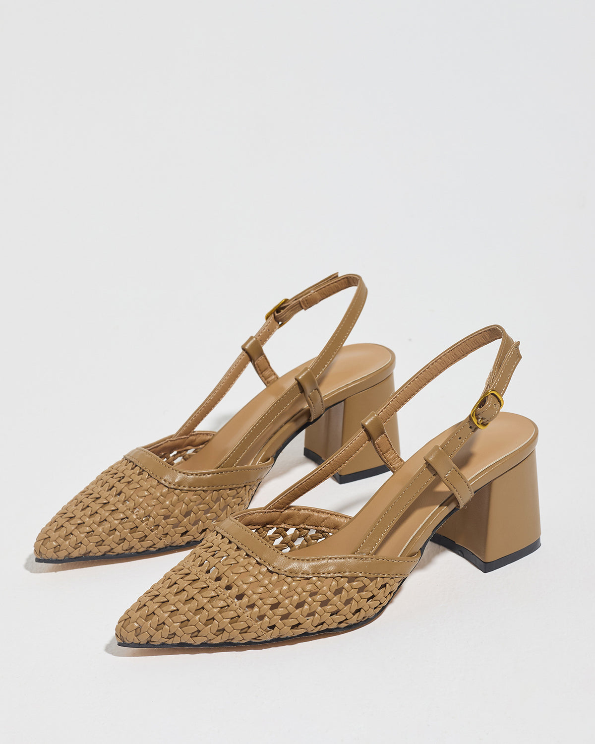 Mescini brown woven pointed toe block heel pumps, angled pair on a white floor, US women's sizes