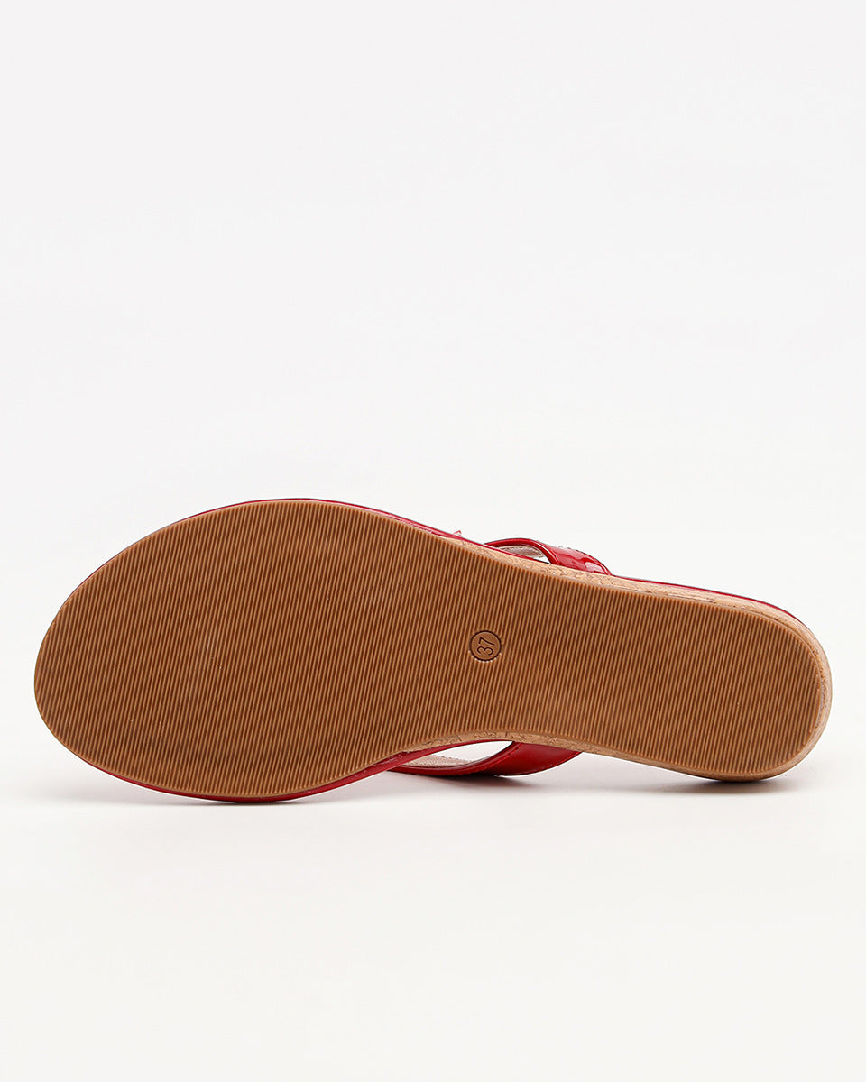 Mescini red toe post low heel slide sandals, one shoe tipped up to show the tan sole, US women's sizes