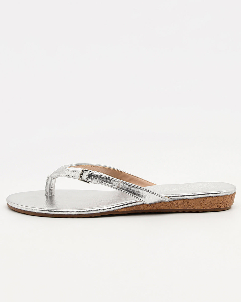 Mescini silver toe post low heel slide sandals, a single shoe seen from the side, US women's sizes