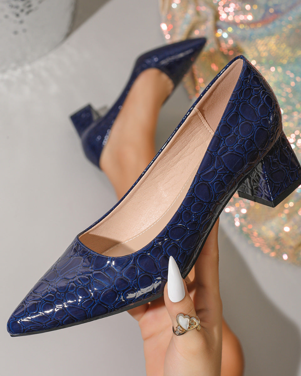 Mescini – navy blue croc embossed block heel pump worn on the foot, US women's sizes
