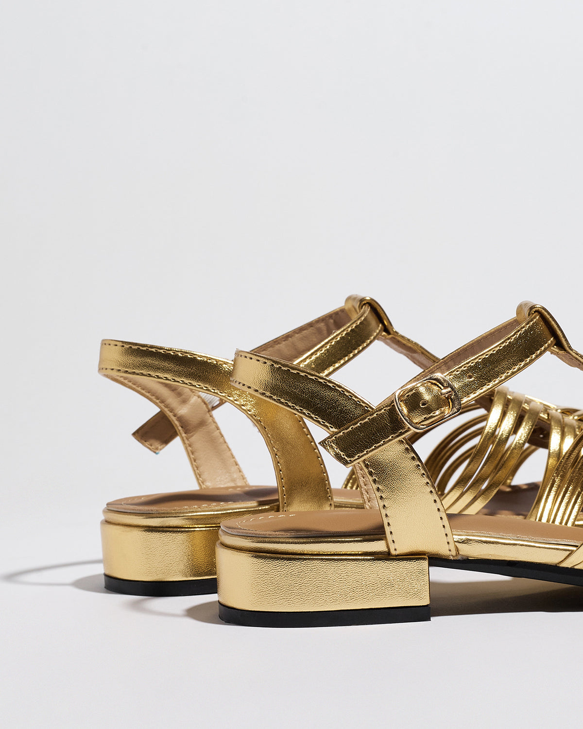 Mescini gold woven closed toe block heel sandals, pair from behind with the slingback strap, US women's sizes