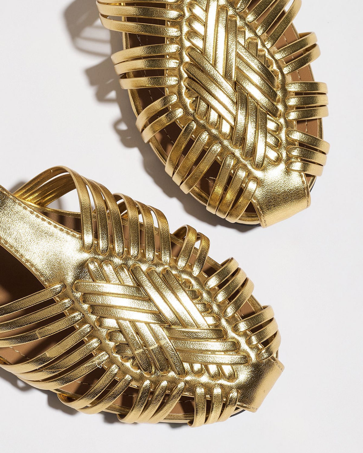 Mescini gold woven closed toe block heel sandals, two uppers seen from above on white, US women's sizes