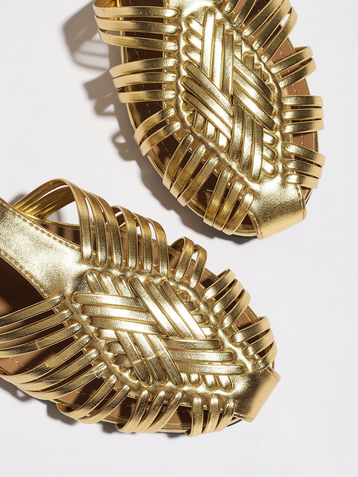 Mescini gold woven closed toe block heel sandals, two uppers seen from above on white, US women's sizes