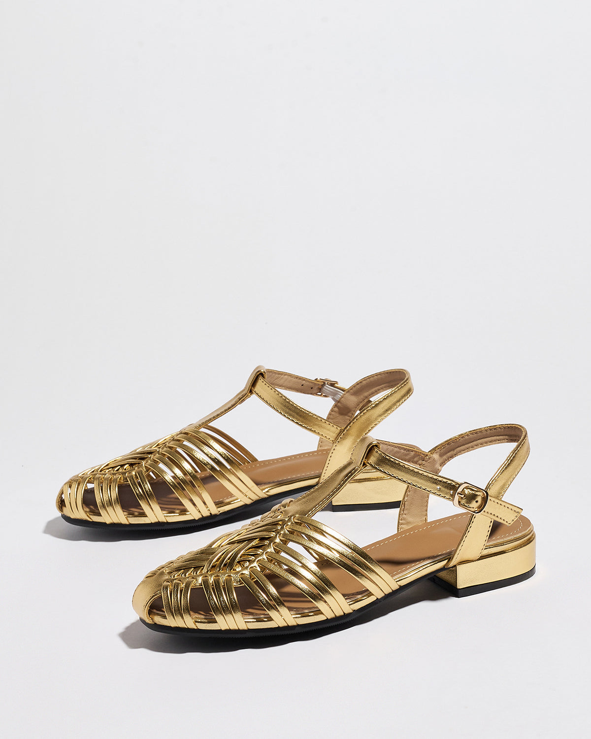 Mescini gold woven closed toe block heel sandals, pair viewed from above at an angle, US women's sizes