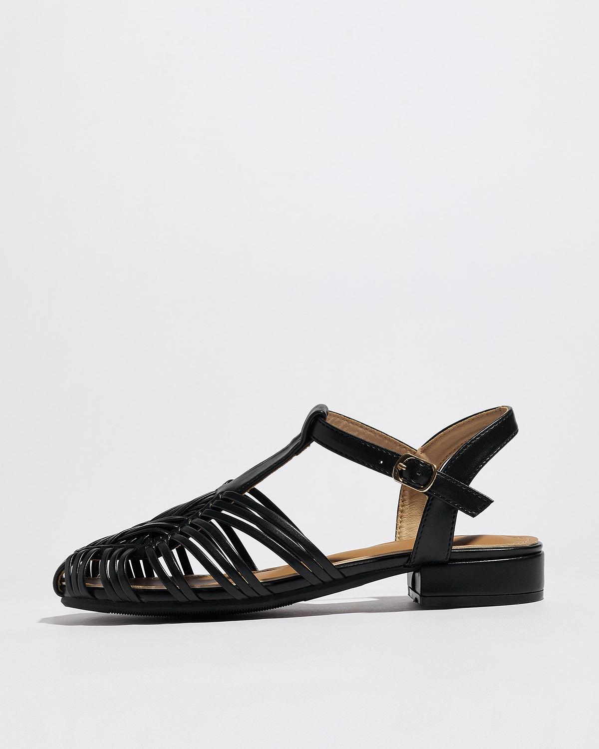 Mescini black woven closed toe block heel sandals, single shoe in profile on a white surface, US women's sizes