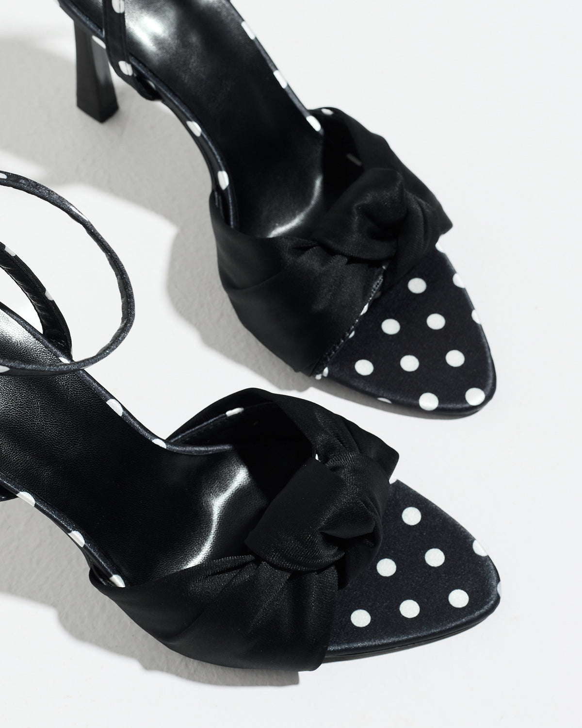 Mescini black knot front polka dot heeled sandals, close up of the knotted toe band, US women's sizes