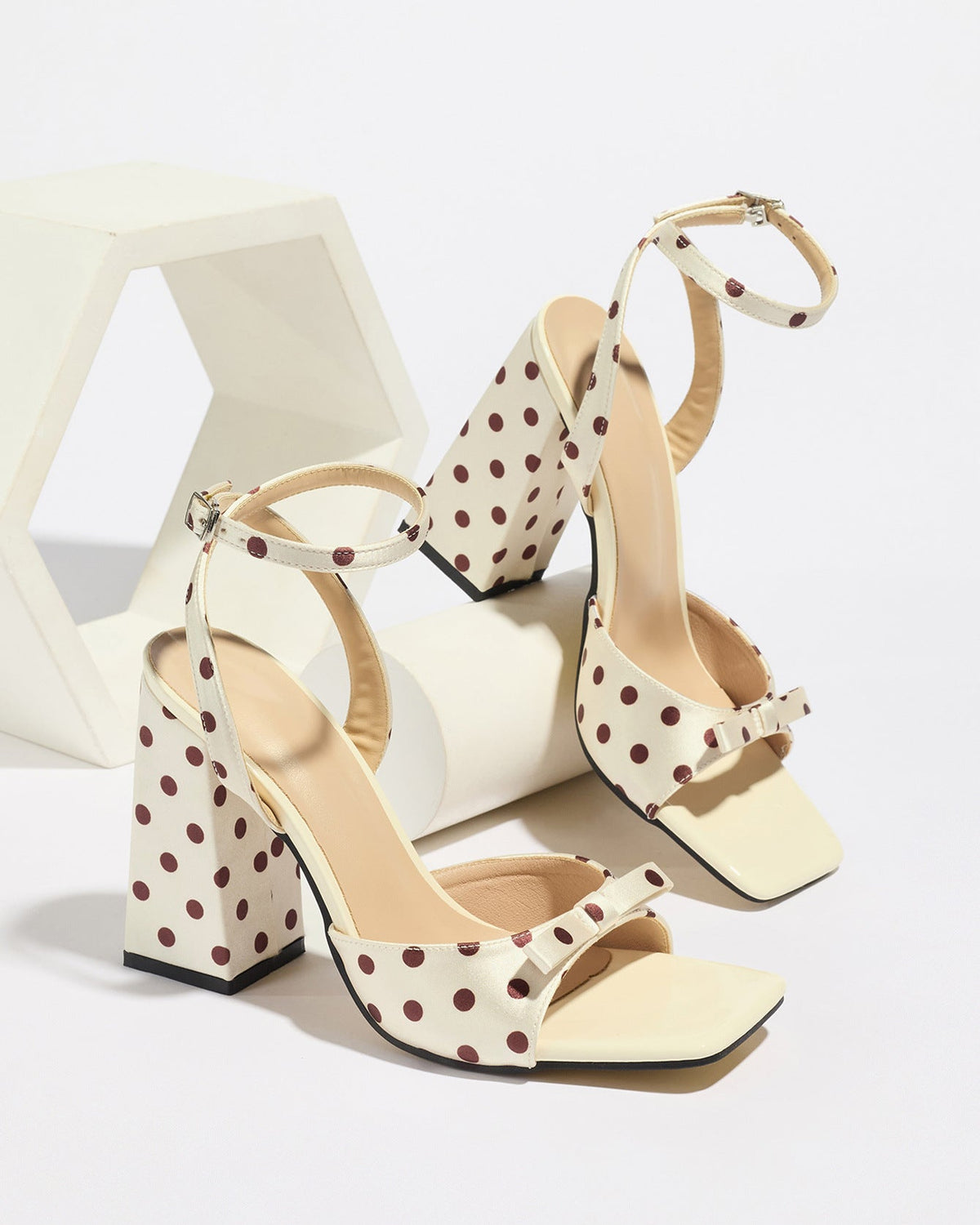 Mescini - Cream polka dot block heel sandal pair on a white riser, studio view, US sizes