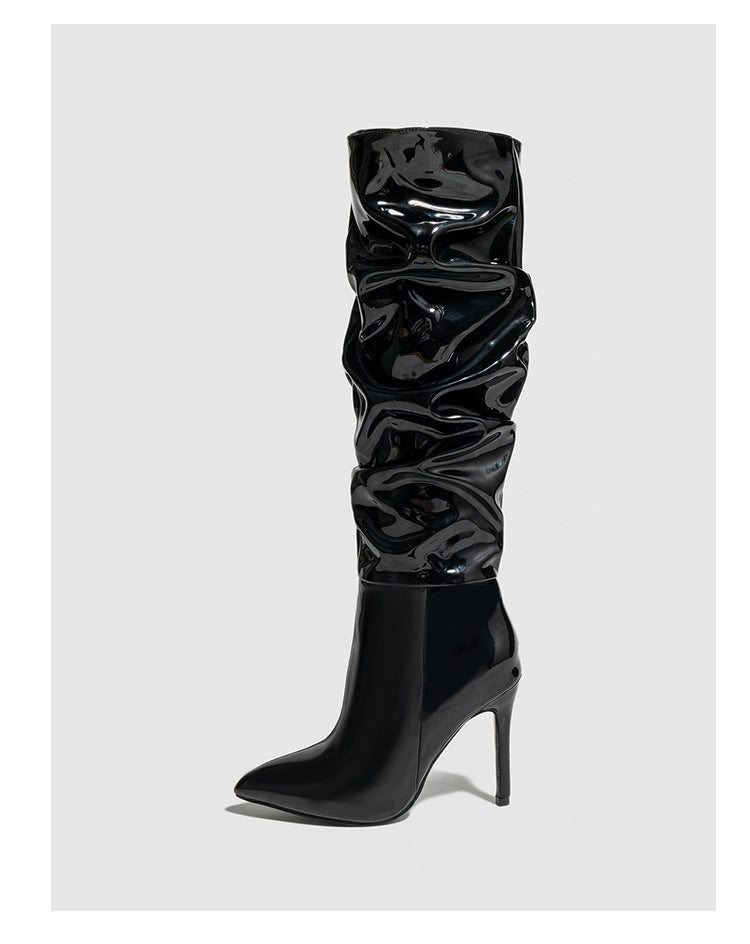 Mescini black ruched patent knee high stiletto boots, single boot on a grey background, US women's sizes