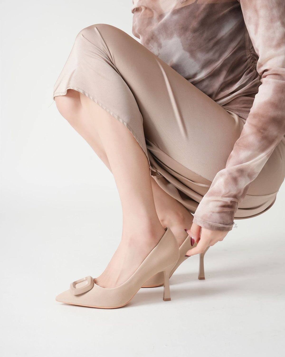Mescini beige square ring pointed toe pumps, model reaching down to the heel, US women's sizes