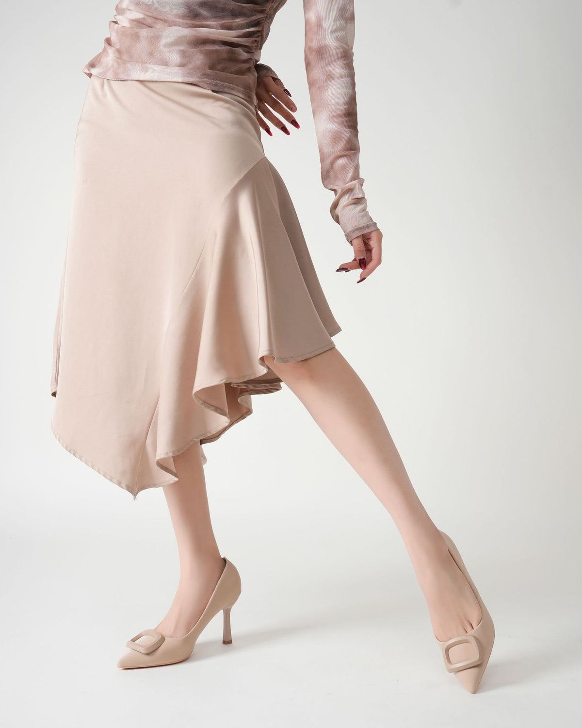 Mescini beige square ring pointed toe pumps seen from behind while walking, US women's sizes