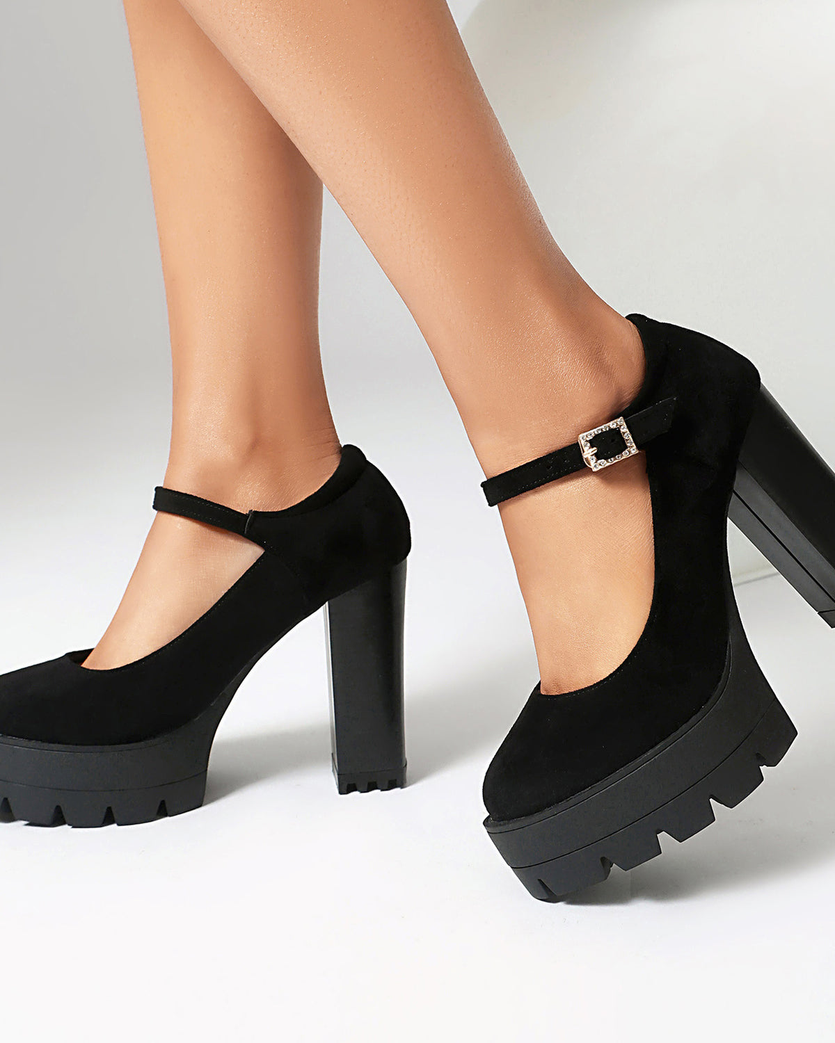 Mescini black platform Mary Jane block heel pumps worn mid stride, side view, US women's sizes