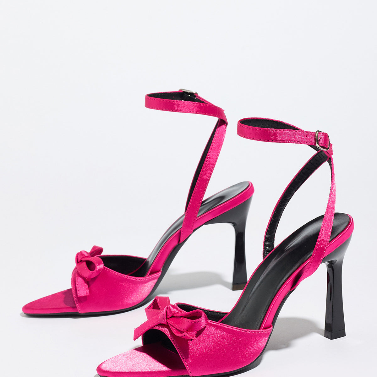 Mescini pink satin bow ankle strap sandals, angled studio pair on a plain white backdrop, US women's sizes