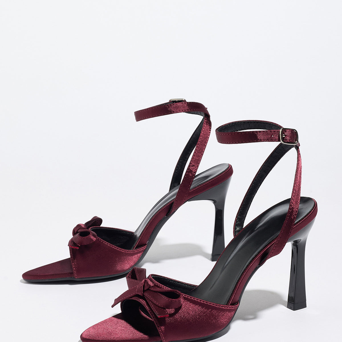 Mescini burgundy satin bow ankle strap sandals, angled pair on a white studio floor, US women's sizes