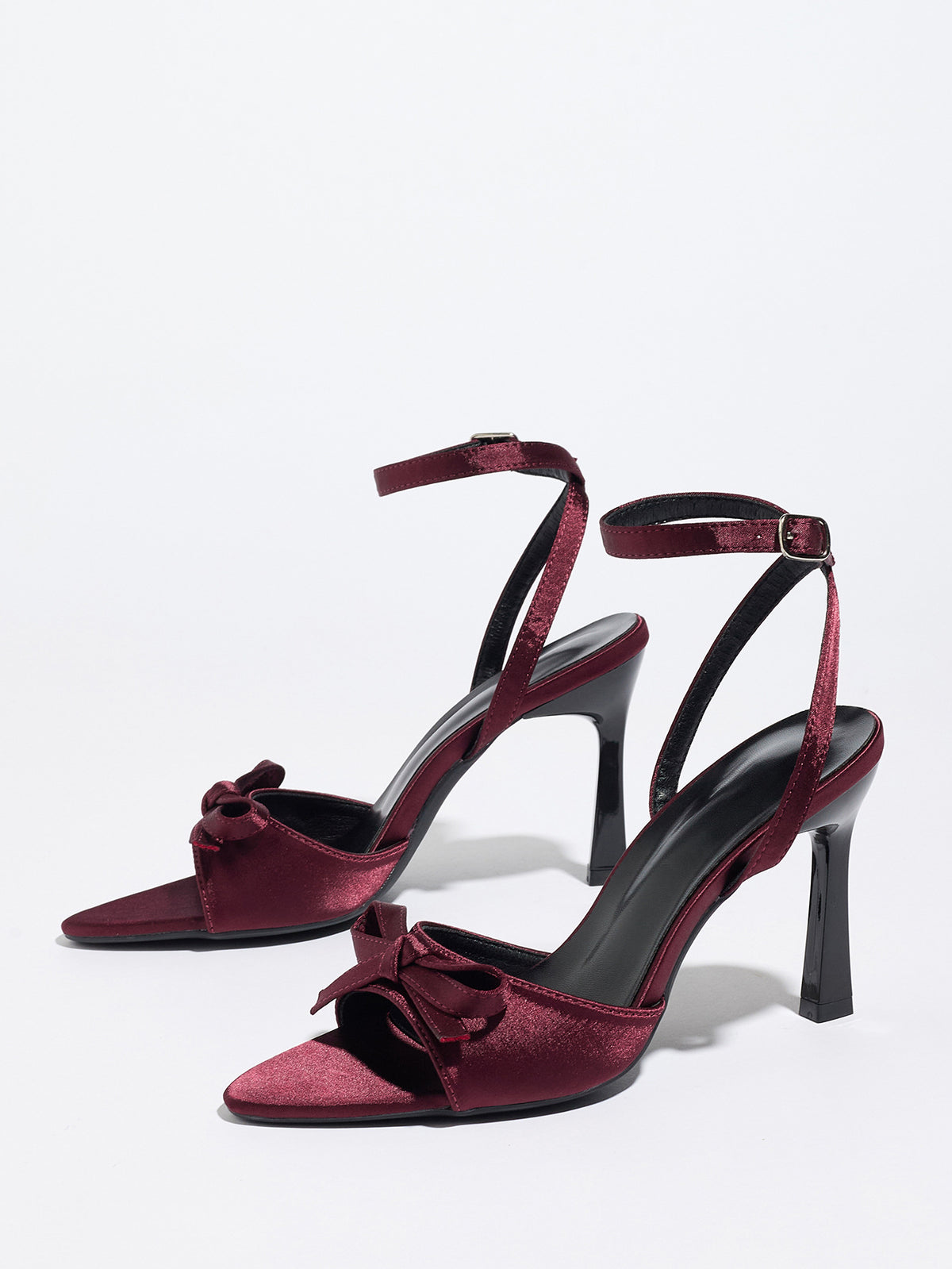 Mescini burgundy satin bow ankle strap sandals, angled pair on a white studio floor, US women's sizes