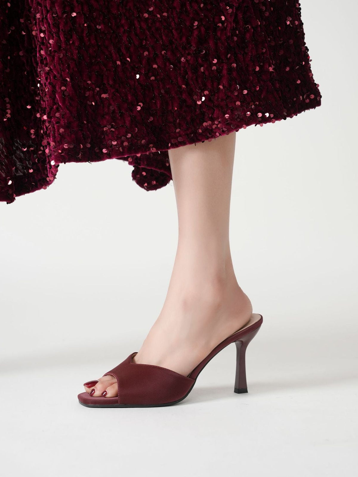 Mescini burgundy wide band square toe mule, single shoe worn mid stride, US women's sizes