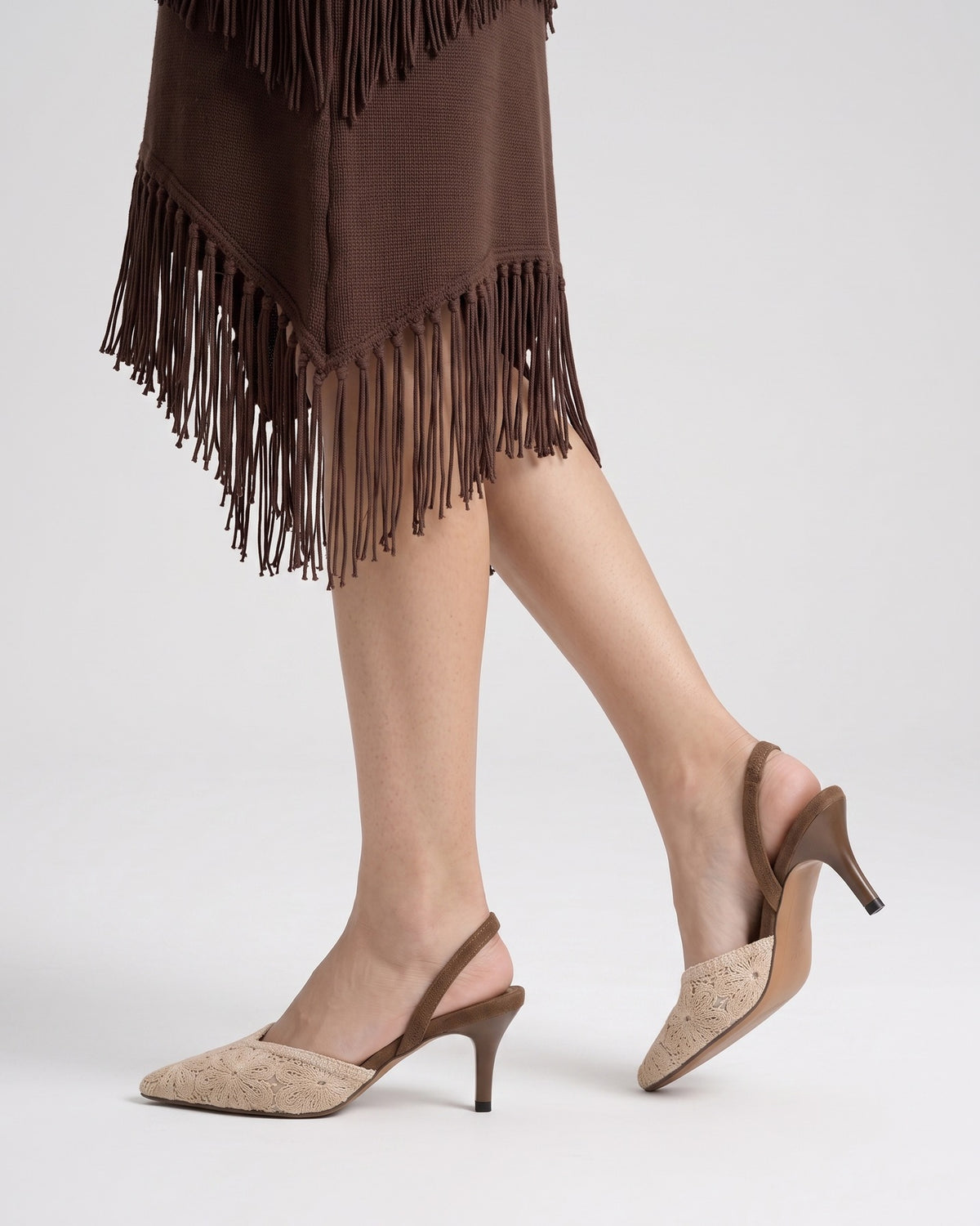 Mescini brown crochet pointed toe slingback heels, worn mid step, side profile view, US women's sizes