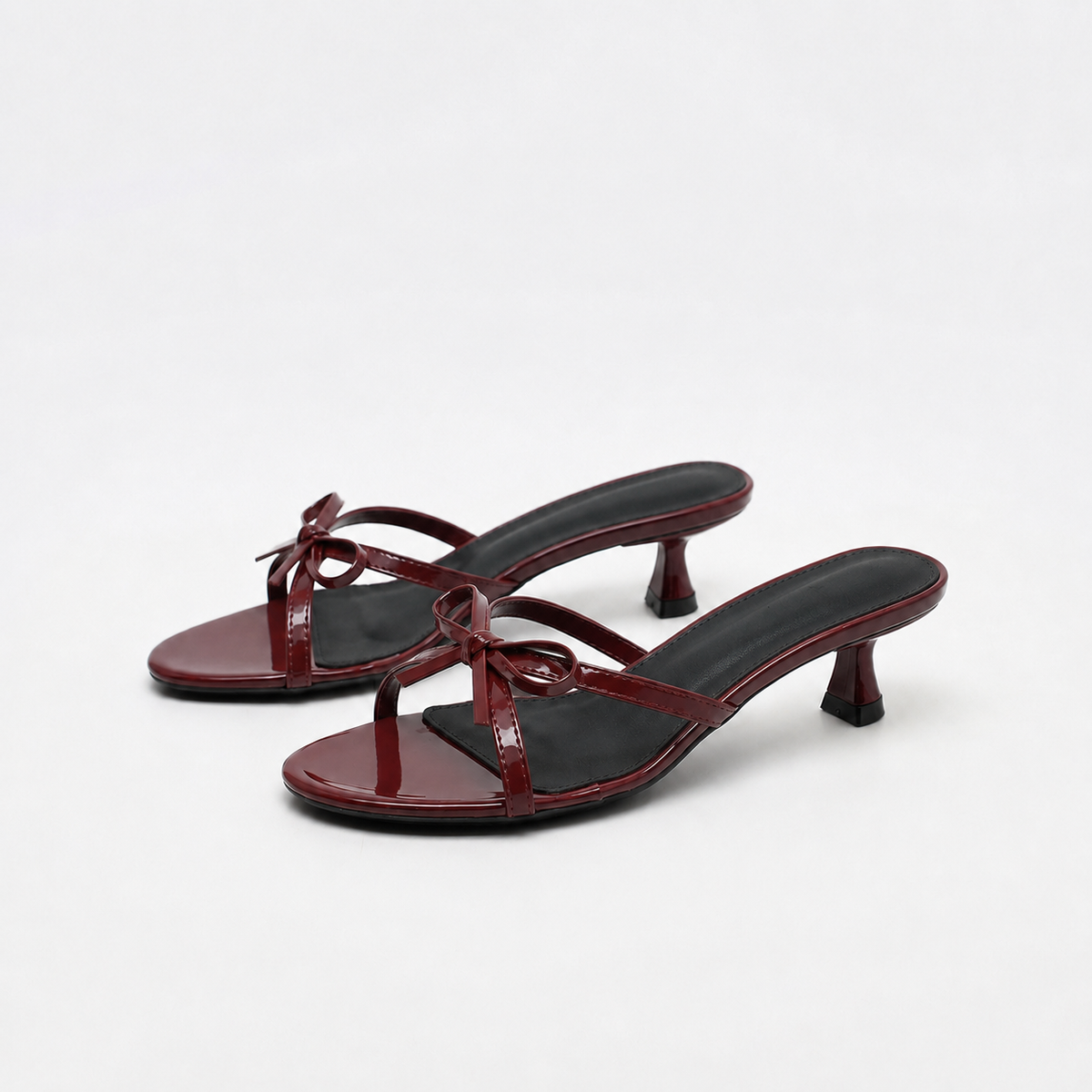 Mescini burgundy bow open toe kitten heel mules, pair angled on a white background, US women's sizes