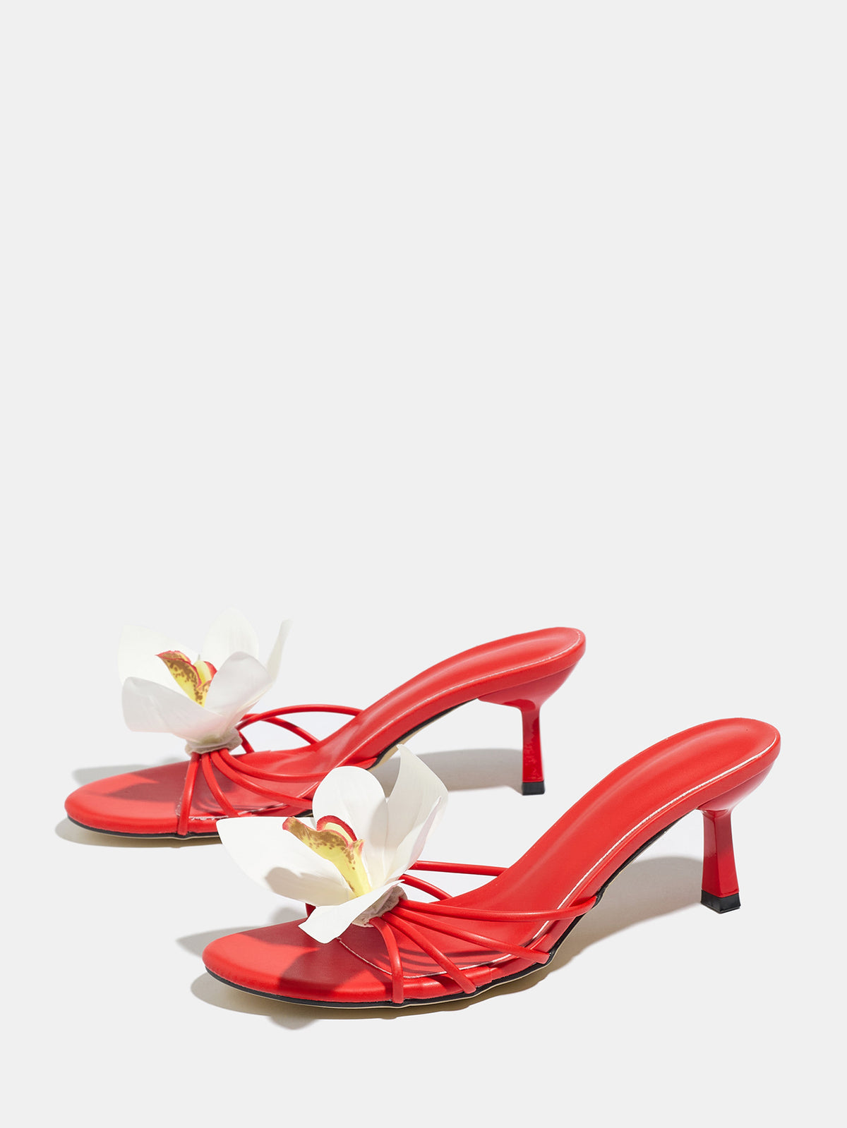 Mescini red orchid bloom strappy heeled mules, angled view of the pair on grey, US women's sizes
