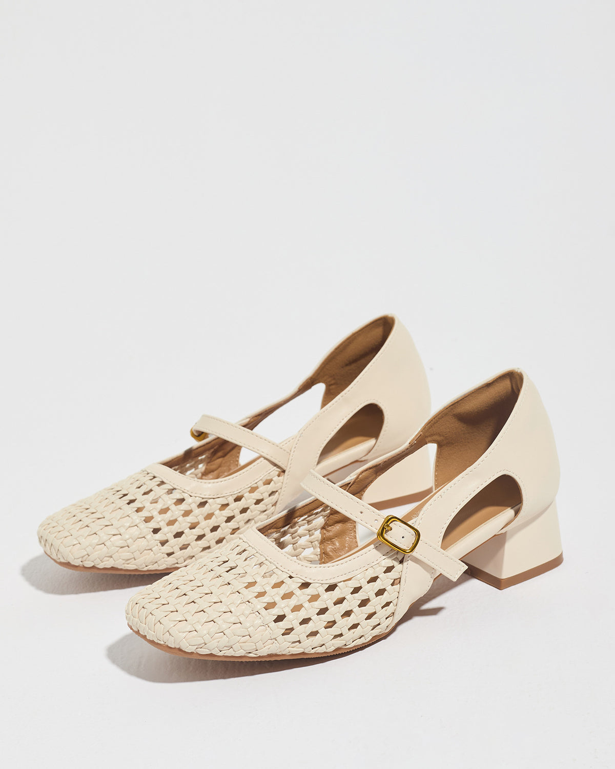 Mescini white woven square toe mary jane heels, pair angled on a pale backdrop, US women's sizes