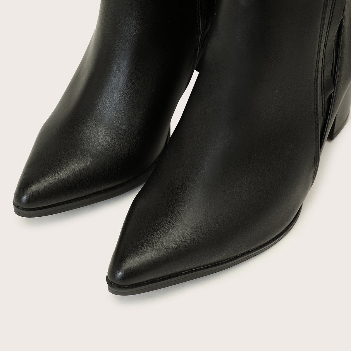 Mescini black chelsea boots, close view of the two long pointed toes side by side