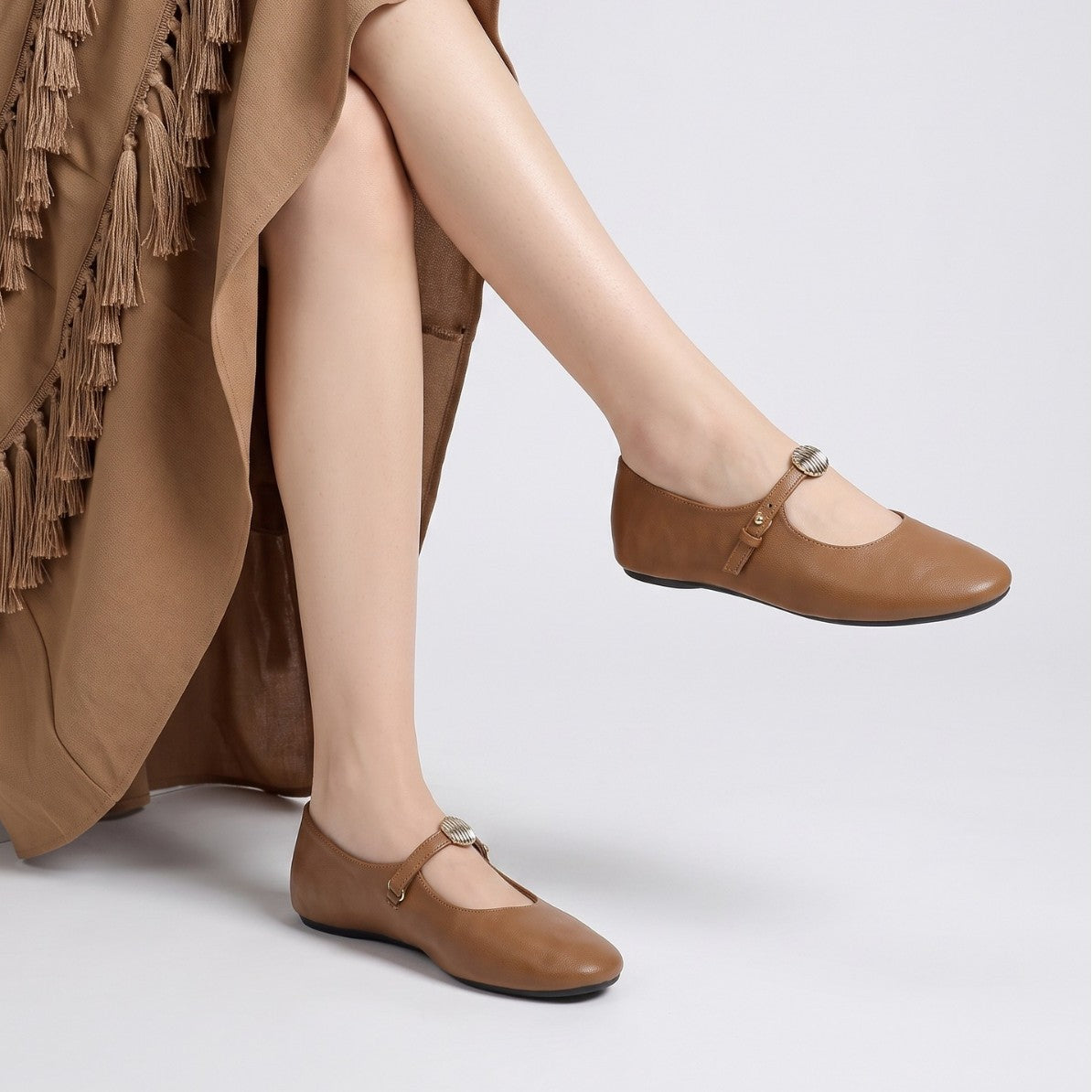 Mescini - camel mary jane flats worn standing, instep strap shown, US women's sizes