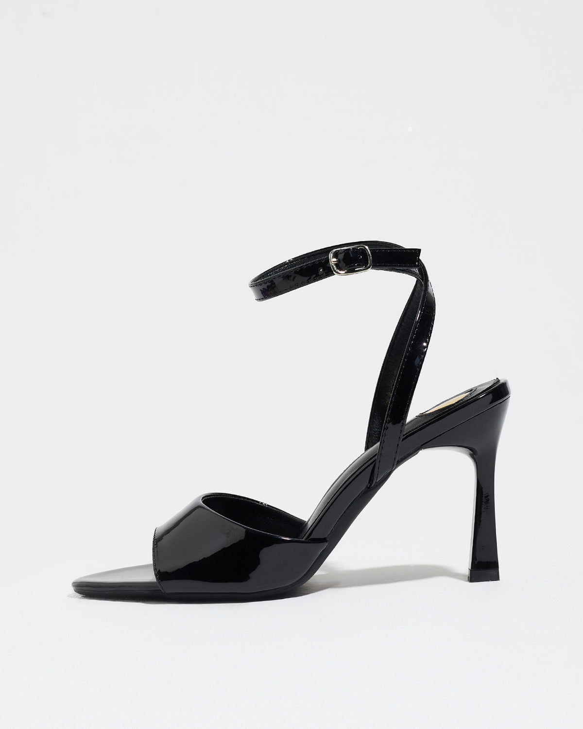 Mescini black single band ankle strap sandals, side profile of one shoe on white, US women's sizes