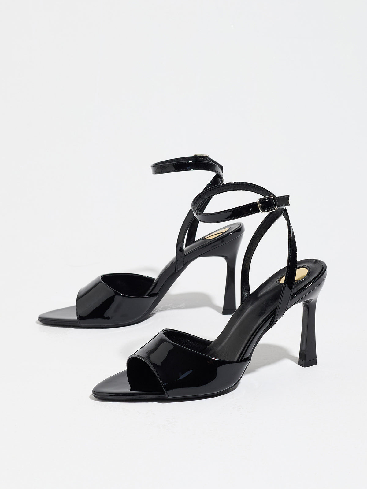 Mescini black single band ankle strap sandals, the pair standing at a slight angle, US women's sizes