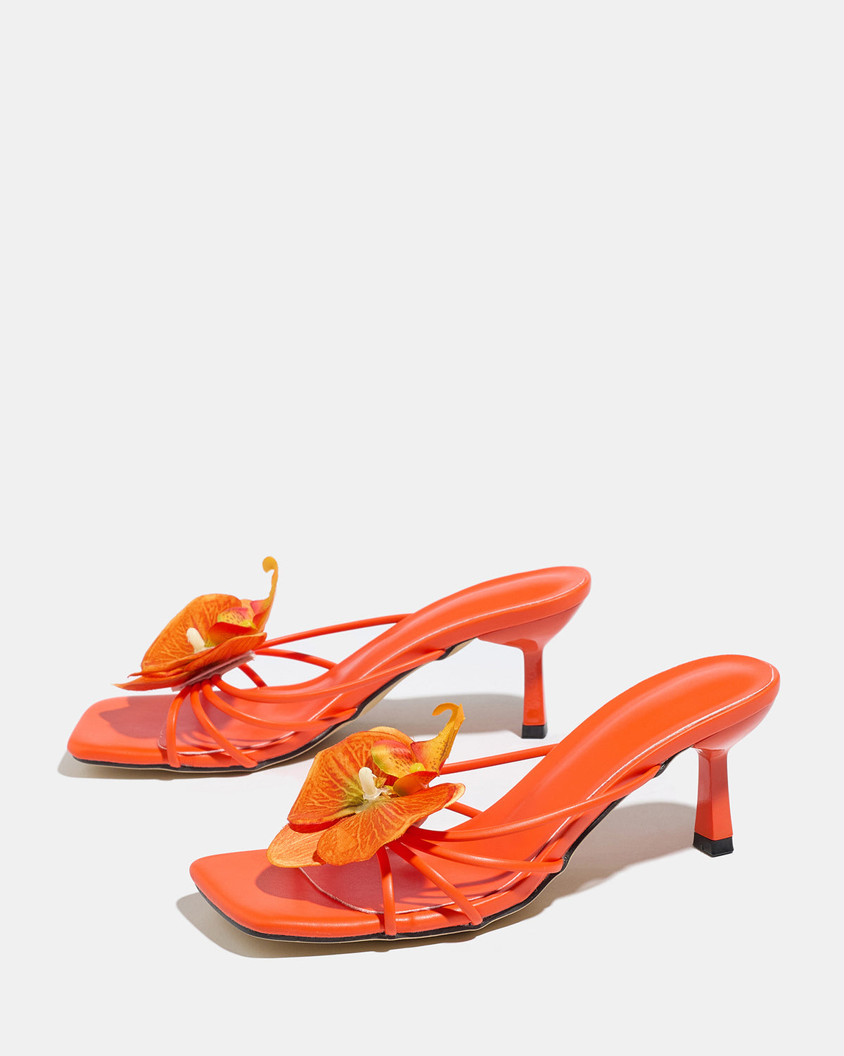 Mescini apricot square toe heeled mule sandals, angled pair on a grey floor, US women's sizes
