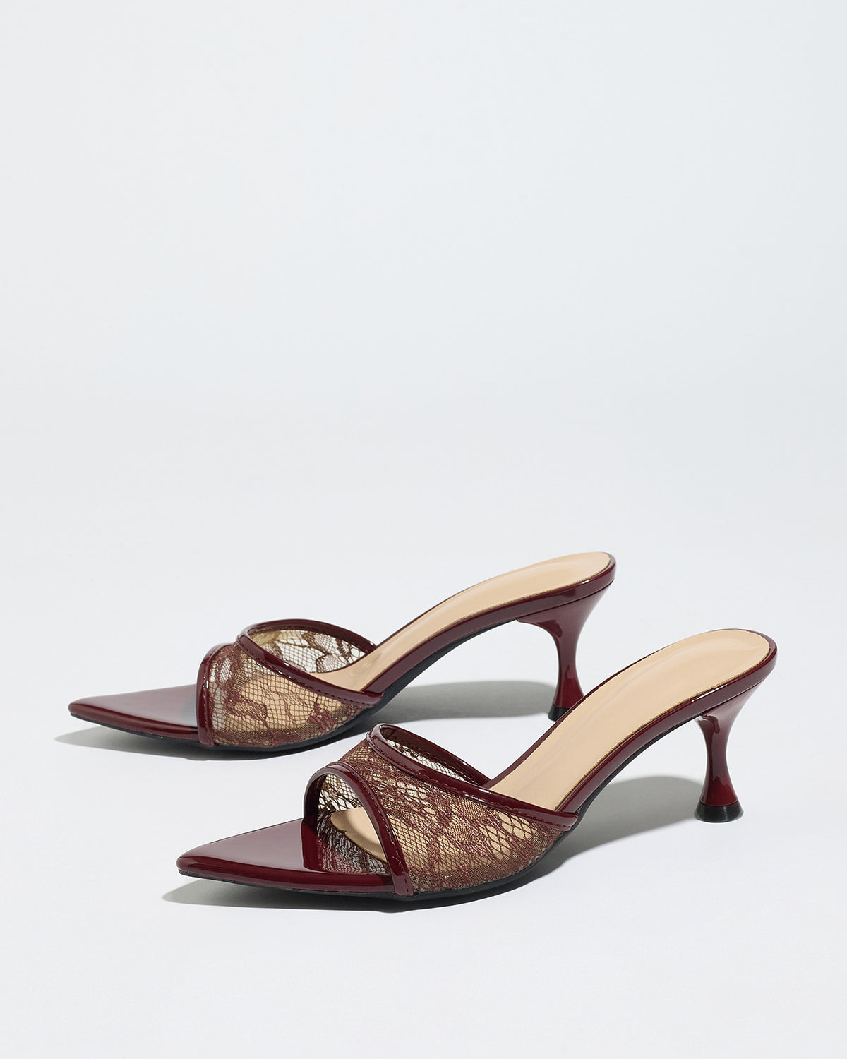 Mescini burgundy sheer lace pointed toe mule heels, angled pair on a pale backdrop, US women's sizes