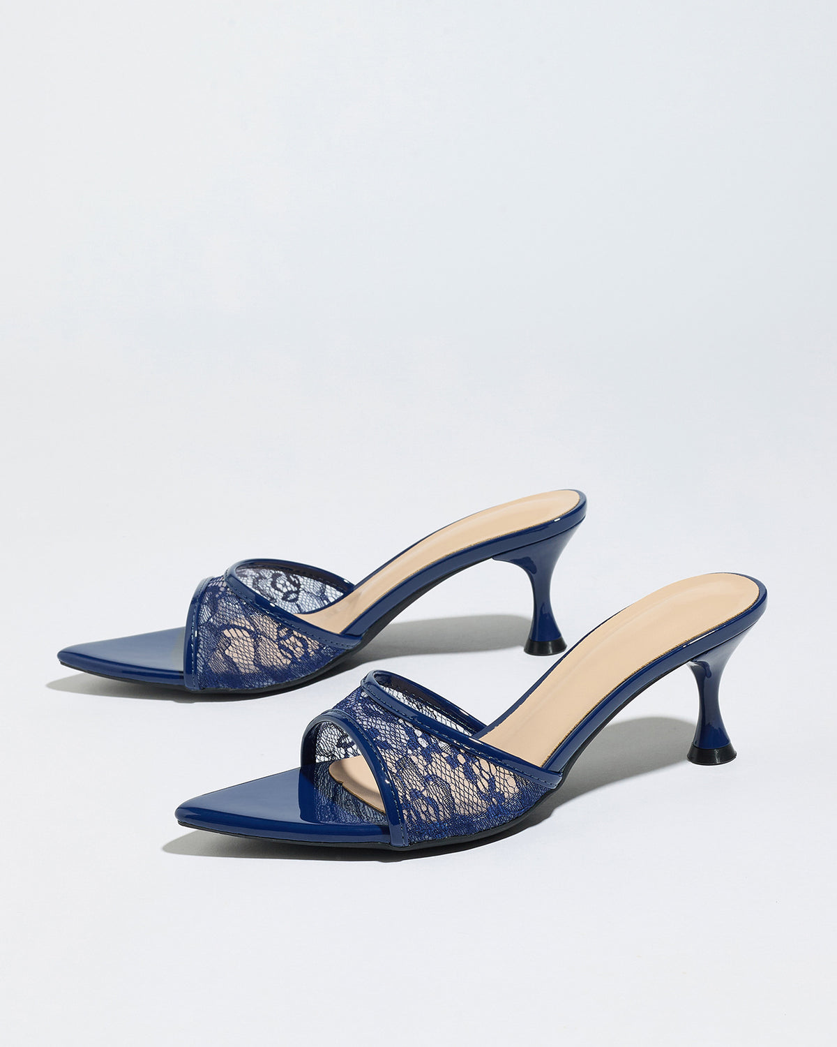 Mescini navy sheer lace pointed toe mule heels, angled pair on a pale grey backdrop, US women's sizes