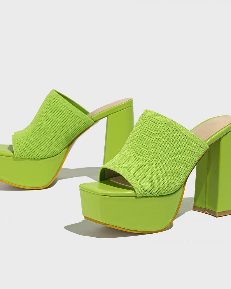 Mescini green knit band platform mule heels, angled pair on a pale grey floor, US women's sizes