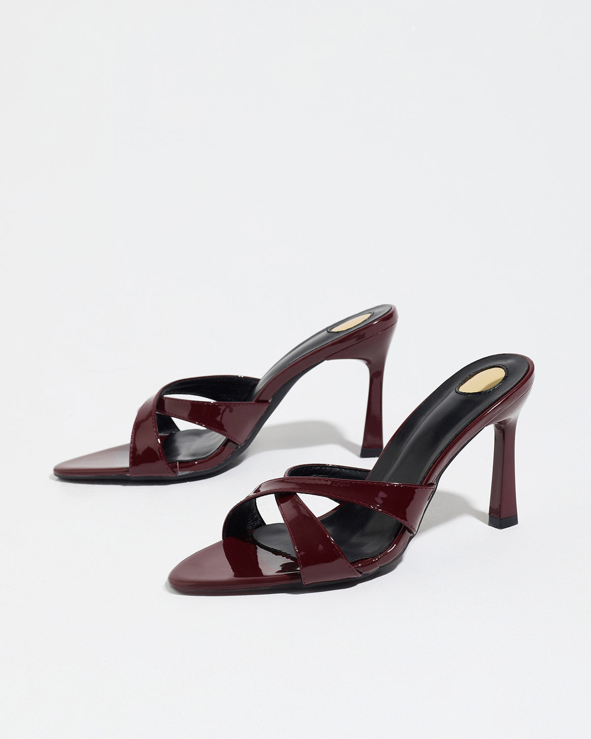 Mescini burgundy cross strap stiletto mule sandals, pair seen from the front, US women's sizes