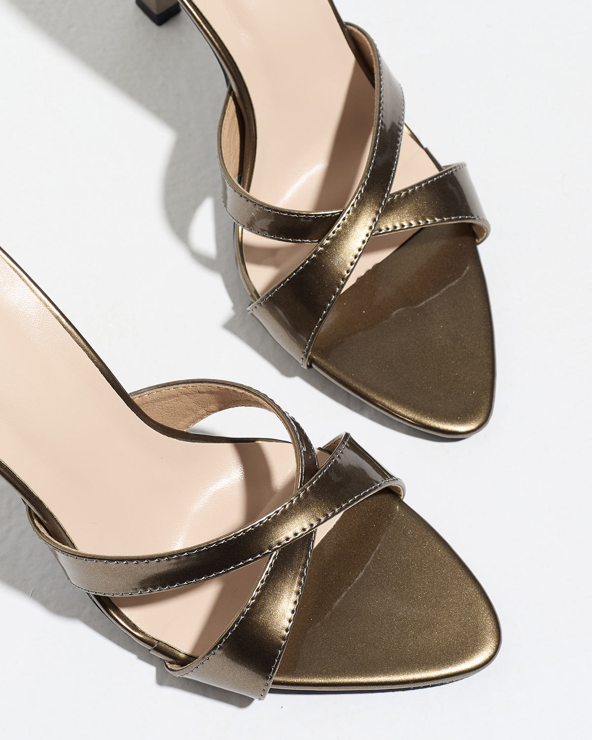 Mescini bronze cross strap stiletto mule sandals, close up of the crossed bands, US women's sizes