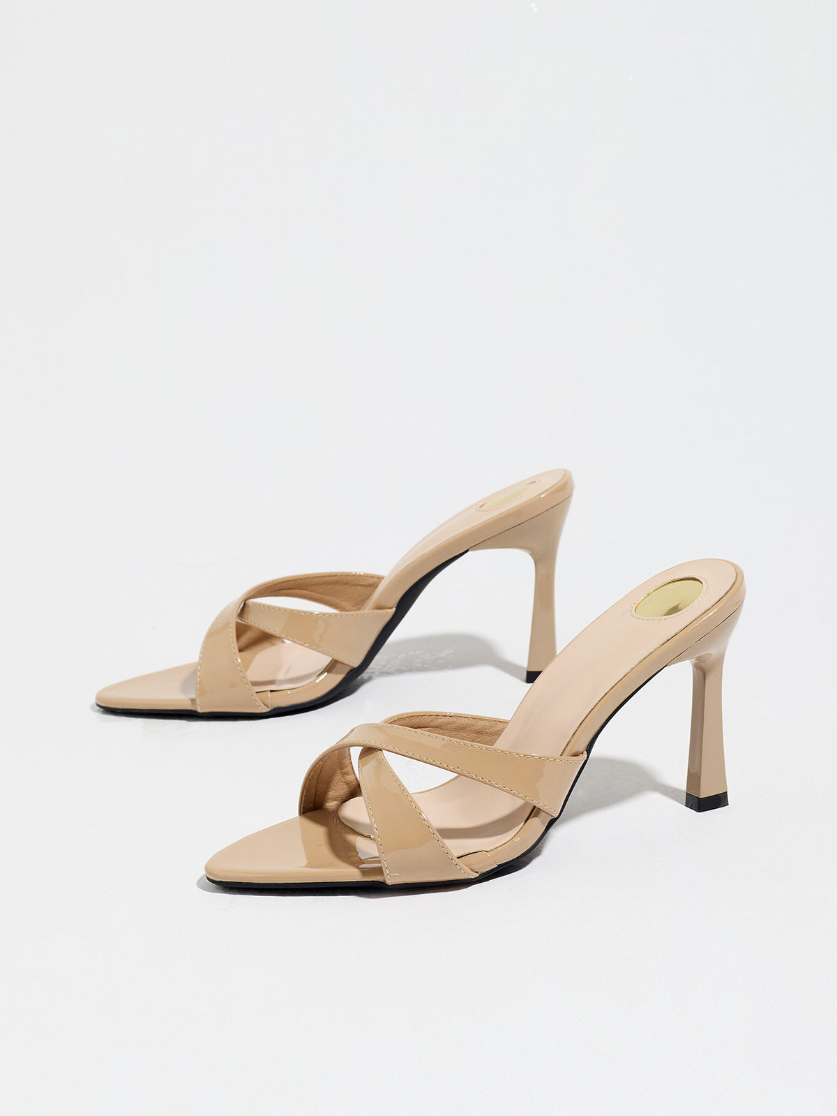 Mescini nude cross strap stiletto mule sandals, pair from a low front angle, US women's sizes