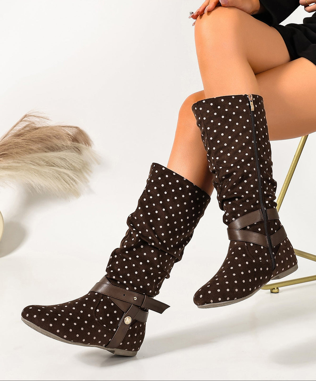 Mescini brown ruched buckle fold over flat boots, worn by a model with a fur throw, US women's sizes