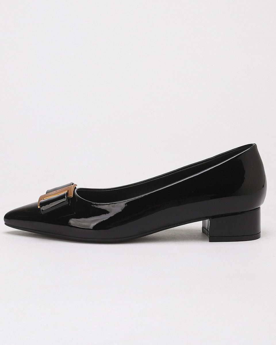 Mescini – black bow pump in side profile with the gold plate detail, US women's sizes shown